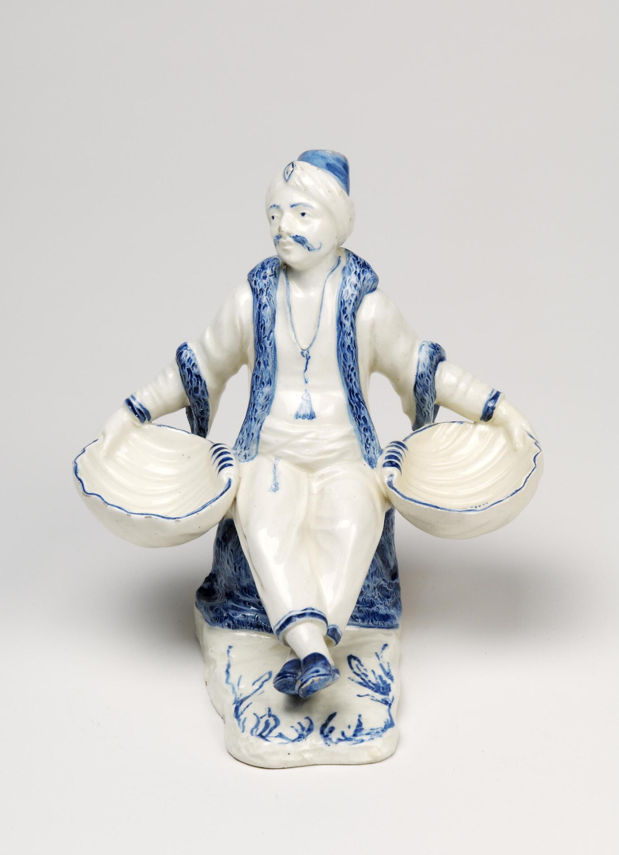 Discover Salt and pepper cellar in the shape of a seated Turk